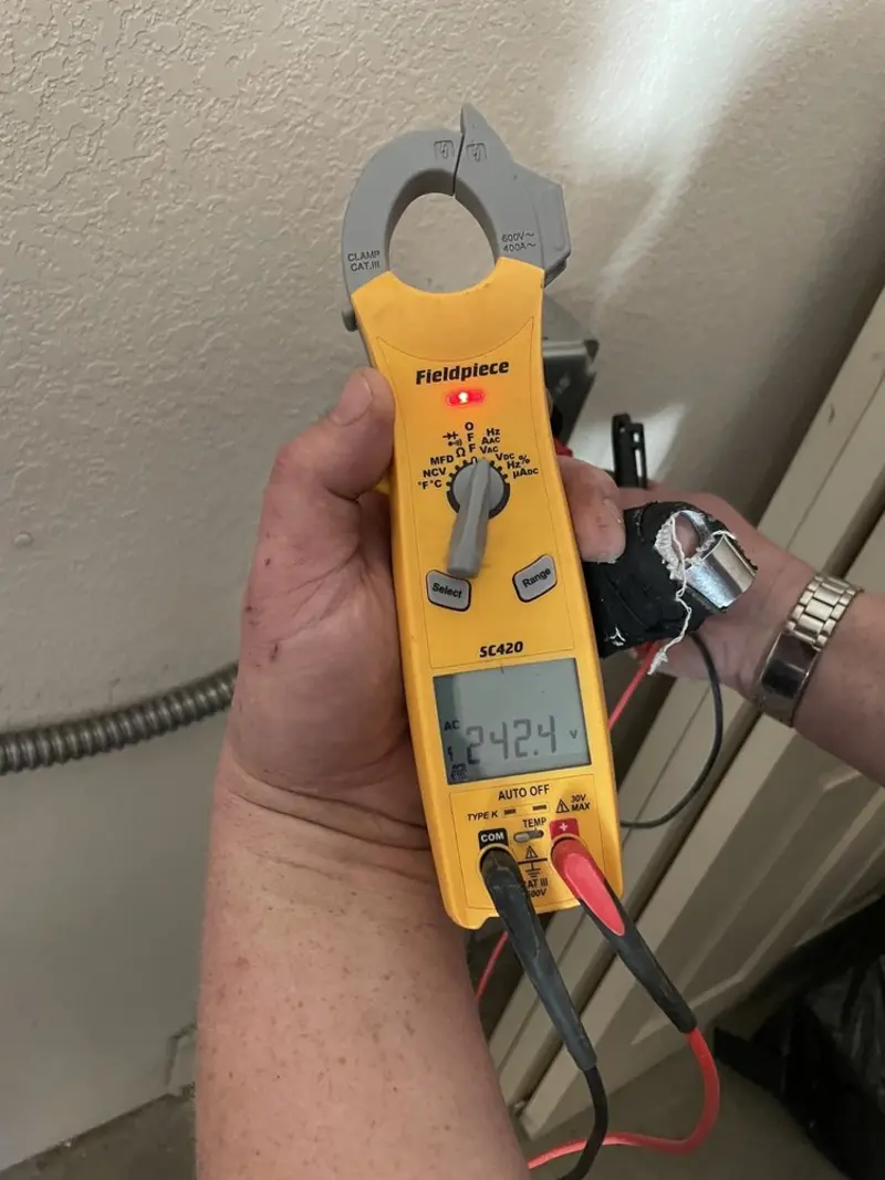 Voltage testing with clamp meter during Circuit Breaker Repair in Tipp City